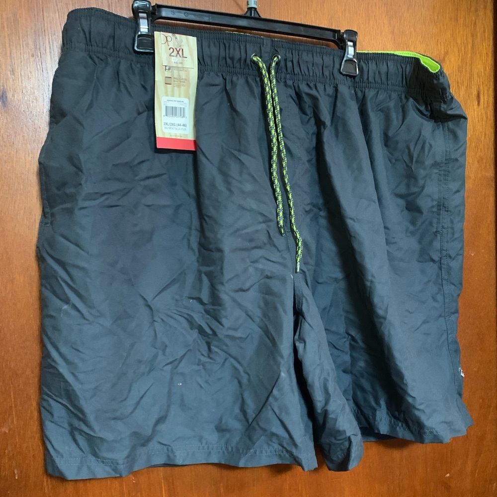 NWT men’s 2X (44-46) swim trunks. Charcoal lime green mesh.